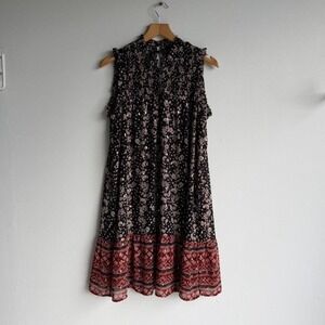Black and red floral midi dress with ruffle hem and tie back detail.